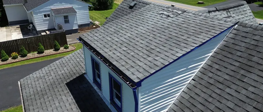 Aerial view of a residential roof, siding, and gutter line